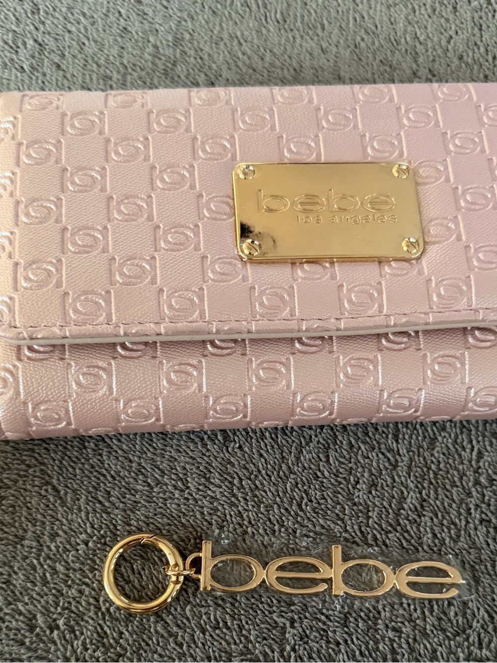 bebe Light Pink Embossed Wallet with Gold Logo Plate